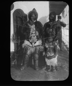 Image: Two Inuit women, boy aboard. Crewman beyond